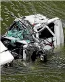  ??  ?? Two people had to be rescued after this truck veered into the Manawatu River.