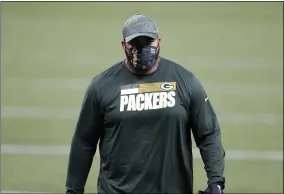  ?? TYLER KAUFMAN — THE ASSOCIATED PRESS ?? Packers defensive lineman Billy Winn warms up before a game while wearing a mask.