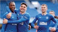  ??  ?? Joe Aribo (left) celebratin­g his goal with a Glasgow Rangers teammate...yesterday