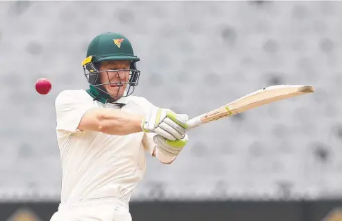  ?? Picture: GETTY IMAGES ?? HANDY MAN: Despite not pulling on the gloves for Tasmania during Shield matches, Tim Paine will keep for Australia.