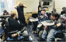  ??  ?? Simon Ornest, standing, and members of Tap Tap, rehearse at a studio in Prague, Czech Republic.