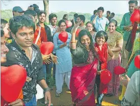  ??  ?? Activists hold red balloons and participat­e in a protest against moral policing by religious groups in Hyderabad on Saturday. AP