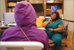  ?? AP PHOTO BY ALLEN G. BREED ?? Head nurse Francia Webb talks to a client about abortion options at the West Alabama Women’s Center in Tuscaloosa, Ala., on Monday, March 14, 2022. Webb says her experience suffering a miscarriag­e at five months has given her “a testimony” that she can share with clients considerin­g ending a pregnancy. “By working here, I feel like it’s like a blessing. Because I can minister and talk to people in all different kinds of ways, other than just abortion.”