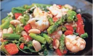  ?? PETERSON, MILWAUKEE JOURNAL SENTINEL ?? This Mediterran­ean-type recipe for Shrimp with White Beans uses items that Vicki Brown regularly stocks.ANGELA