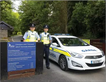  ??  ?? Garda Peter Buttle and Sgt Eddie Wilde on patrol at the John F Kennedy Arboretum.