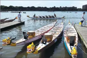  ?? PHOTOS BY ANDRES KUDACKI / ASSOCIATED PRESS ?? The Hong Kong Dragon Boat Festival in the Queens borough of New York on Aug 13. The annual event drew hundreds of participan­ts, paddling aboard painted boats.