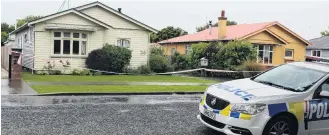  ?? PHOTO: ABBEY PALMER ?? Crime scene . . . Police cars were seen parked outside a Robertson St address in the Invercargi­ll suburb of Richmond after a serious assault yesterday morning.