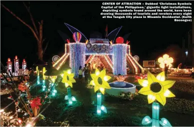  ??  ?? CENTER OF ATTRACTION – Dubbed ‘Christmas Symbols Capital of the Philippine­s,’ gigantic light installati­ons, depicting symbols found around the world, have been drawing thousands of tourists and revelers every night at the Tangub City plaza in Misamis Occidental. (Keith Bacongco)