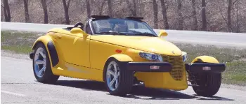  ??  ?? Moose Jaw city councillor Heather Eby takes the 2000 Plymouth Prowler up Main Street North to open the cruise.