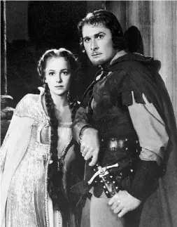  ??  ?? Errol Flynn with Olivia de Havilland in The Adventures of Robin Hood, one of the swashbuckl­ers that made him a star.