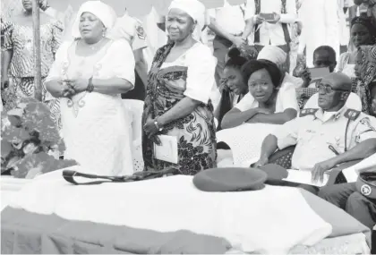  ??  ?? The widow, Mrs Dinatu Elisha (3rd left); Her sister, Mrs Rhoda David, and Zonal Commander, Federal Road Safety Commission, Bauchi State, Mr Luka Ikpi, during the funeral of Road Marshal Inspector, Mr Elisha Ilah, in Bauchi yesterday. Photo NAN