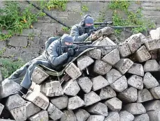  ??  ?? Prepared: A team of officers then bursts into the station, while snipers lie in wait. An armed ‘terror attacker’ who has taken hostages is removed from the train