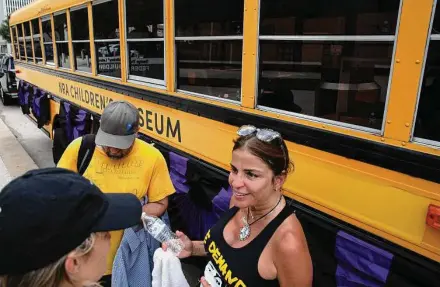  ?? Yi-Chin Lee/Staff photograph­er ?? Fifty-two buses and 20 parents — including Patricia Oliver, mother of Parkland, Fla., shooting victim Joaquin — make up what organizers call “The NRA Children’s Museum,” which displays personal items of children killed by gun violence.