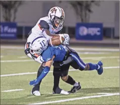  ?? Courtney Couey, Ringgold Tiger Shots ?? Jacob Garnica crunches a Hart County receiver to dislodge the ball during Friday’s playoff game. Garnica and the Tigers will travel to fourth-ranked Thomson this Friday for a second-round showdown.