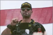  ?? ALLISON DINNER — THE ASSOCIATED PRESS FILE ?? Proud Boys leader Henry “Enrique” Tarrio wears a hat that says The War Boys during a rally in Portland, Ore. in Sept. 2020. A barrage of bickering between lawyers and the judge has bogged down the seditious conspiracy trial of former Proud Boys leader Enrique Tarrio and four associates. Defense attorneys have repeatedly argued in vain for the judge to declare a mistral.