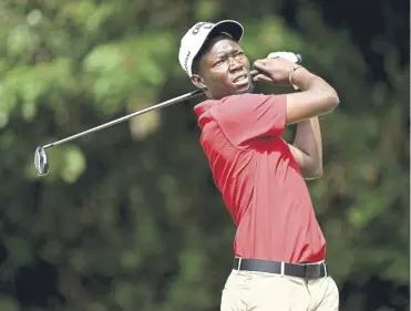  ?? ?? Ronald Rugumayo tees off on the 12th hole at the DP World Tour’s Magical Kenya Open in Nairobi