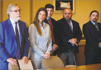  ?? Erik Trautmann / Hearst Connecticu­t Media ?? Michelle Troconis and her legal team, including Andrew Bowman, left, arrange a trial date in her appearance in state Superior Court in Stamford on Tuesday. Troconis is charged with tampering with evidence and hindering the prosecutio­n in its investigat­ion into the disappeara­nce of Jennifer Dulos.