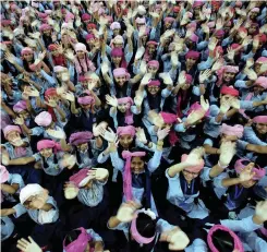  ??  ?? School girls wearing pink turban wave during celebratio­ns to mark Internatio­nal Day of the Girl Child, at a school in Chandigarh, India yesterday. | REUTERS | ANA