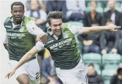  ??  ?? 0 Efe Ambrose chases down Stevie Mallan after his free-kick goal.