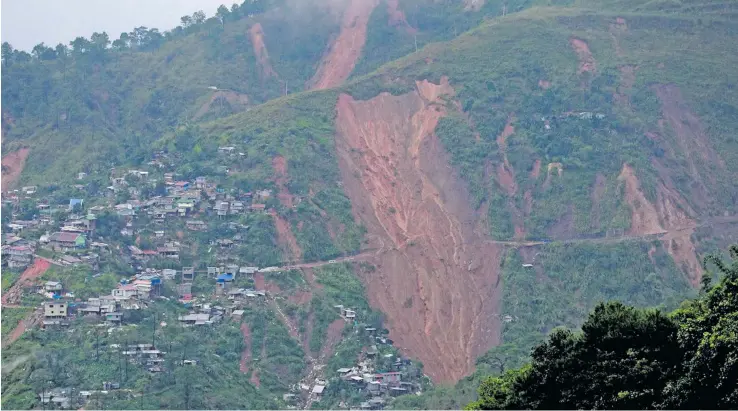  ??  ?? Search and retrieval operations are underway for missing miners who may have been buried at a mining shelter in Itogon, Benguet during the onslaught of Typhoon Mangkhut over the weekend.