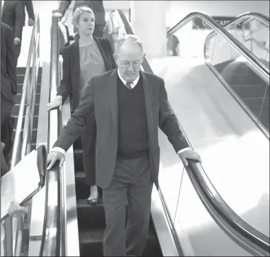  ?? Scott Applewhite/ AP ?? Healthcare: Sen. Lamar Alexander, R-Tenn., takes the escalator down as he returns to his office after appearing on the Senate floor with Sen. Patty Murray, D-Wash., to defend their bipartisan proposal for resuming federal subsidies to health insurers...