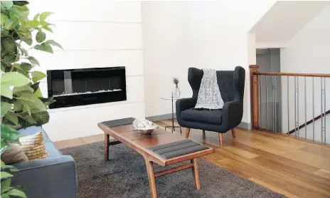  ?? JENNIFER JACOBY-SMITH ?? The D&S Homes show home on Underhill Bend in Brighton features gorgeous oak engineered hardwood flooring. The warm colour and wide planks make the space modern and inviting, while the fireplace offers a striking focal point in the living room.