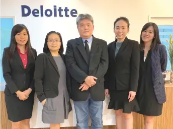  ?? ?? The Deloitte Kuching team.