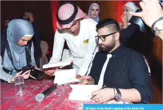  ??  ?? Ali Najm at his book’s signing at the Book Fair.