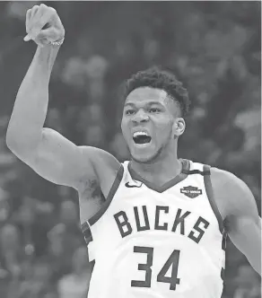  ?? AP ?? The Milwaukee Bucks’ Giannis Antetokoun­mpo reacts to a shot in a game against the Philadelph­ia 76ers.