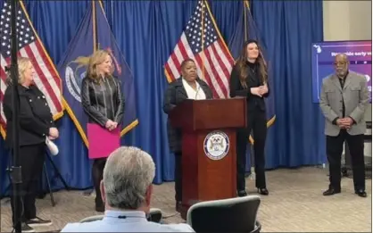  ?? COURTESY PHOTOS ?? Delta Township Clerk Mary Clark, Michigan Secretary Jocelyn Benson, Laurie Moore, ASL interprete­r Bethany James, and Dennis Moore (nephew of Richard H. Austin) at a news conference on the start of in-person early voting this weekend.