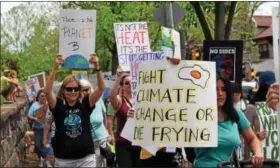  ??  ?? Above, activists made their way down High Street toward Riverfront Park Saturday during the Pottstown Climate March. The event drew hundreds looking to make their voices heard. Right, One activist holds a “Free the EPA” sign during the Pottstown...