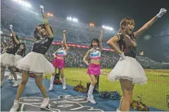  ?? ISAAC LAWRENCE/NEW YORK TIMES ?? Cheerleade­rs perform during a May 13 game at the Taoyuan Internatio­nal Baseball Stadium.