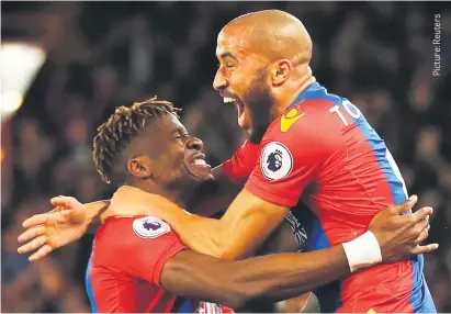  ??  ?? TAKES TWO TO TANGO. Crystal Palace’s Andros Townsend, right, celebrates scoring their first goal with Wilfried Zaha who provided the assist in their Premier League match against Arsenal at Selhurst Park last night.