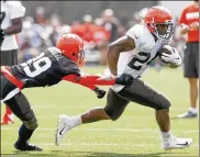  ?? RON SCHWANE / ASSOCIATED PRESS ?? Running back Nick Chubb (24) runs around cornerback Terrance Mitchell during practice July 29 in Berea. “I’m a late bloomer,” Mitchell says, “and I’m actually getting better in time like wine.”