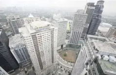  ?? ?? The skyline of a business district is seen from a commercial building in Ortigas, Pasig city, Metro Manila.