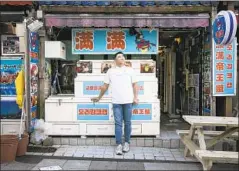  ?? Woohae Cho For The Times ?? KIM KYOUNG- CHUL at his restaurant on South Korea’s Jeju Island. His business was booming before Chinese tourism plummeted in 2017.