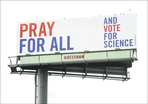  ?? Arnold Gold / Hearst Connecticu­t Media ?? Above and below, two of a series of three billboards with messages incorporat­ing religion, science and voting on southbound Interstate 95 in West Haven.