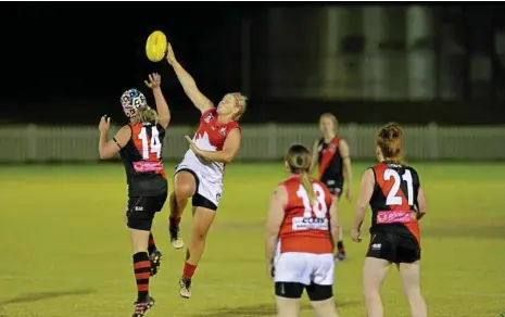  ?? PHOTO: KEVIN FARMER ?? NEW ADDITIONS: South Toowoomba’s Stacy Tindale (left) and Dalby’s Shaye Easton compete for control of the ball. AFL Darling Downs has announced it will expand it’s women’s competitio­n in 2018 with the addition of Coolaroo and University Cougars sides.