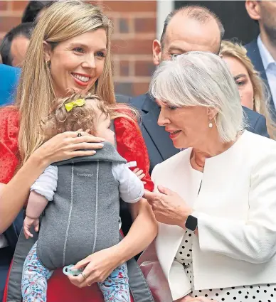  ?? ?? Nadine Dorries with former PM’s wife Carrie Johnson and baby Romy in July