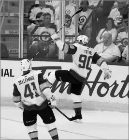  ?? ASSOCIATED PRESS ?? LAS VEGAS GOLDEN KNIGHTS’ TOMAS TATAR (90) celebrates with Pierre-Edouard Bellemare (41) after Tatar scored on Winnipeg Jets goaltender Connor Hellebuyck (37) during first period game 2 NHL Western Conference Finals hockey action in Winnipeg, Manitoba,...