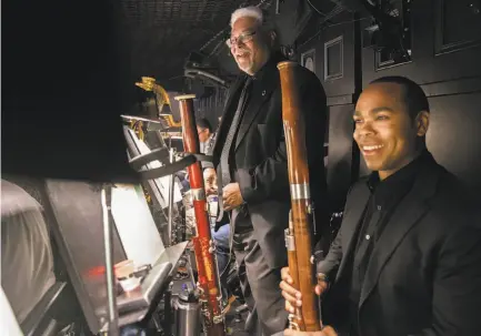  ?? Jessica Christian / The Chronicle ?? Principal bassoonist Rufus Olivier Jr. and son Rufus David Olivier in the orchestra pit.