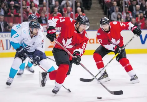  ?? ERNEST DOROSZUK ?? Team Canada’s Brad Marchand carries the puck up the ice against Team Europe during first-period action in Game 1 of the World Cup of Hockey final at the Air Canada Centre in Toronto on Tuesday night. Marchand gave Canada a 1-0 lead after firing in a...