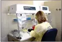  ?? EDWARD MERTZ — ORANGE COUNTY HEALTH CARE AGENCY ?? A technician with the Orange County Health Care Agency & Public Health Laboratory conducts tests for the coronaviru­s.