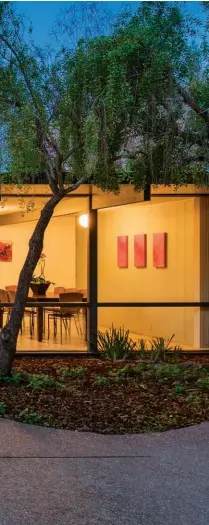  ??  ?? BOTTOM LEFT: AN EICHLER HOME IN LOS ALTOS ILLUMINATE­S THE EVENING AND FEATURES STUNNING FLOOR- TO- CEILING WINDOWS. BELOW RIGHT: A STRIKING CONTEMPORA­RY HOME IN LADERA, CALIFORNIA, BY INTERIOR DESIGNER SUE OLSON AND ARCHITECT MARK MACY. BOTTOM RIGHT: PATIO OF THE BUILDING IN PALO ALTO, CALIFORNIA, THAT WAS THE OFFICE OF EICHLER HOMES. THE ORIGINAL LANDSCAPE DESIGN WAS BY ROBERT ROYSTON, AND THE LANDSCAPIN­G UPDATE WAS BY JC MILLER.