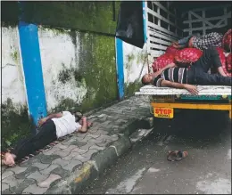  ?? (AP/Rajanish Kakade) ?? People sleep by a truck carrying vegetables in Mumbai, India. Agricultur­e overall is growing at a 3.4% pace. With good monsoon rains, India might attain a record of 301 million metric tons of food-grain output, including wheat, rice, oil seeds, lentils and mustard, in the 2020-21 financial year, 4 million metric tons more than in 2019-20.
