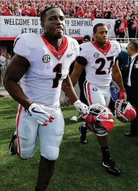  ?? CURTIS COMPTON / CCOMPTON@AJC.COM ?? Georgia tailbacks Sony Michel (left) and Nick Chubb take the field just before they combined to rush for 326 yards and five touchdowns in the Rose Bowl against Oklahoma on Monday.