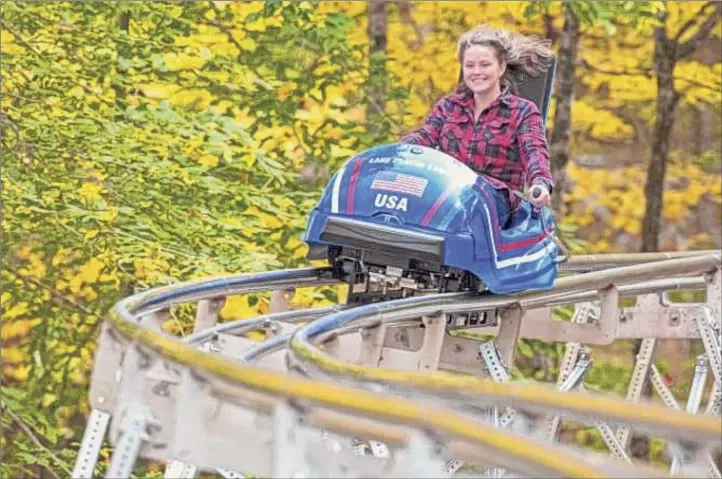  ?? Aquatic Developmen­t Group ?? The Cliffside Coaster can hit 25 mph rolling down the route of the 1932 and 1980 bobsled track at Lake Placid.