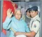  ?? HT ?? RJD chief Lalu Prasad boards Rajdhani Express to New Delhi in Ranchi on Wednesday.