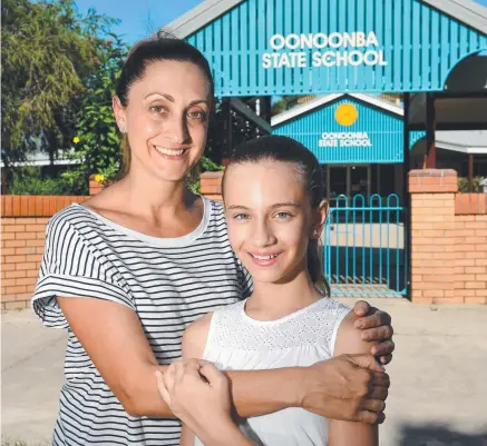  ?? Picture: EVAN MORGAN ?? TAKE HEART: Drosia Parliaros with her daughter Angelina, 11, at Oonoonba State School.