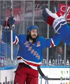  ?? AP POOL PHOTO ?? The Rangers’ Mika Zibanejad (93) celebrates after scoring his third goal for a hat truck during a 6-3 win over the Buffalo Sabres on Sunday night at Madison Square Garden in New York.